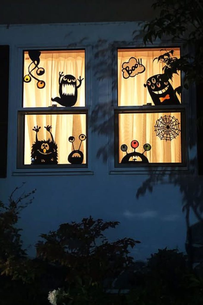 Screaming monster face painted on window.
