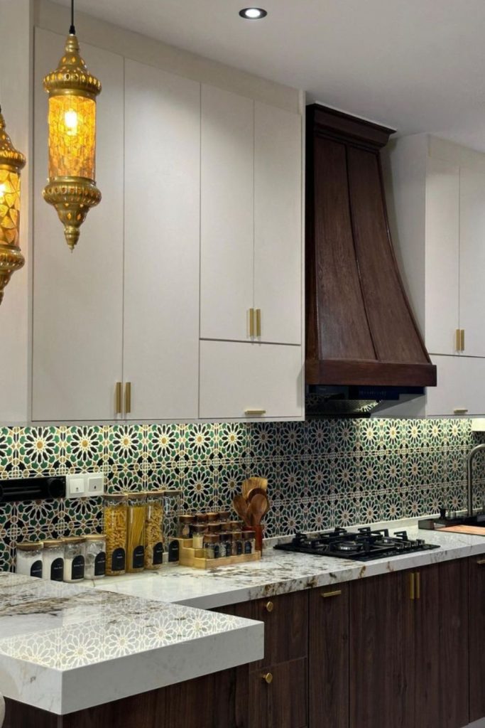 Moroccan mosaic kitchen with brass lights.