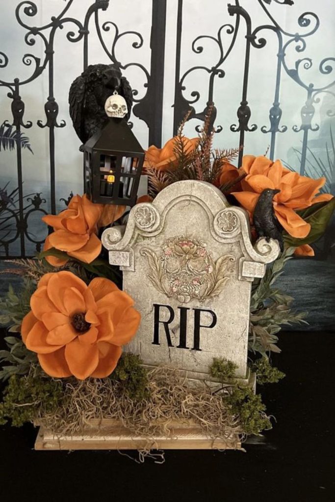 Pumpkin grave centerpiece with silver crosses.