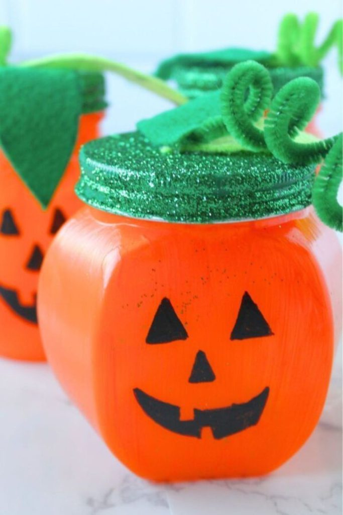 Pumpkin slime jars with glitter sparkles.
