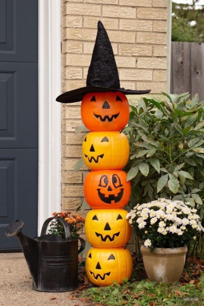 Pumpkin totem guardians glowing in fog