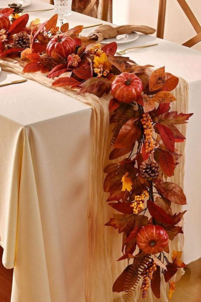 Pumpkin vine garland with fairy lights.