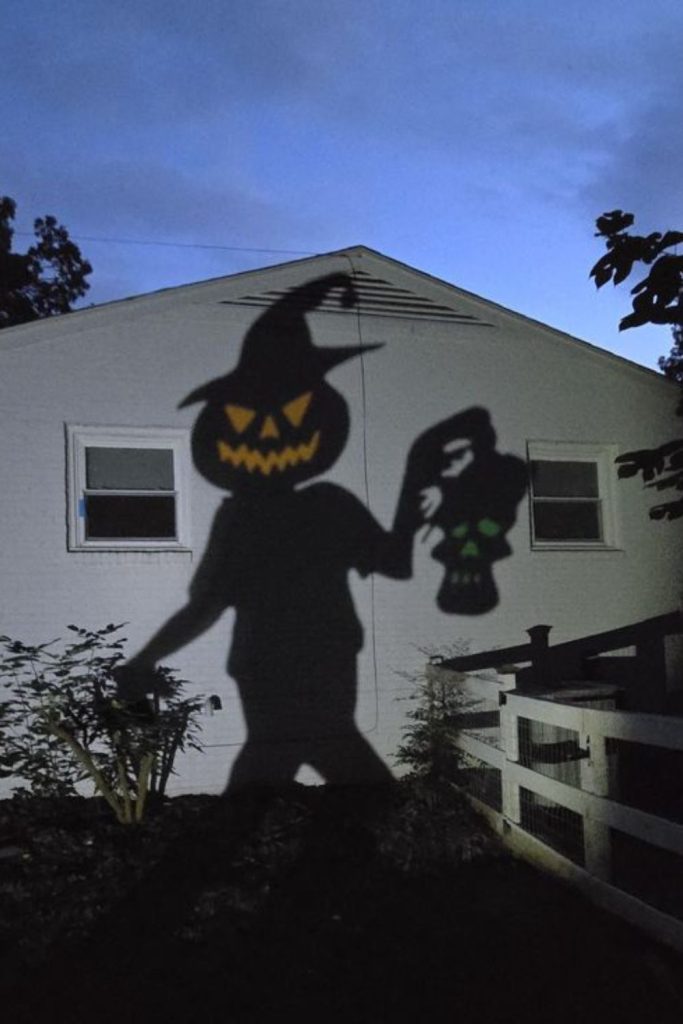 Sinister shadow hands reaching from windows