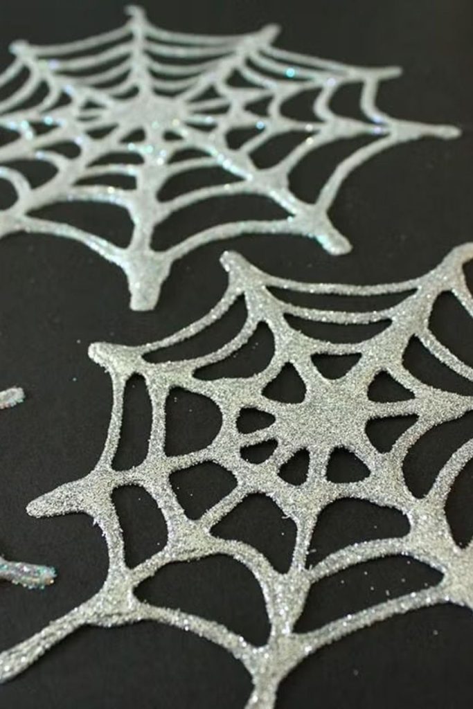 Cotton spider webs with glitter details.