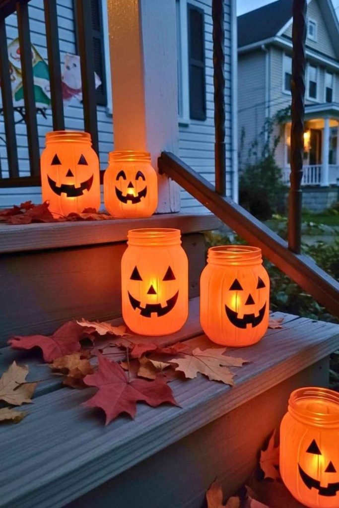 Painted candle jars with Halloween glow.