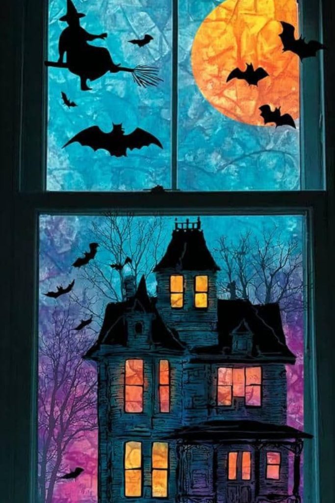 Haunted house silhouette painted on glass.