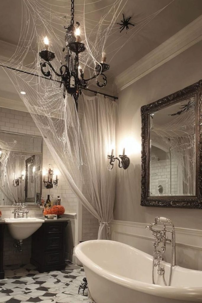 Victorian cobwebbed Halloween washroom with chandelier and tub.