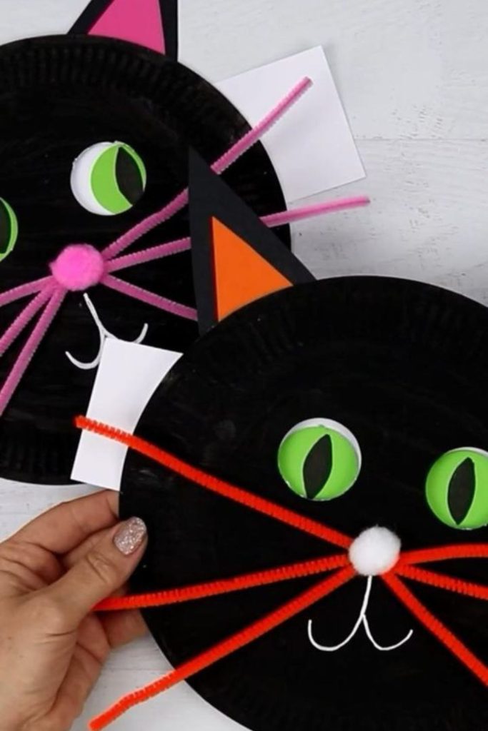 Black paper cat fans with eyes.