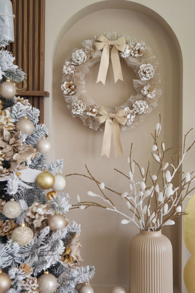 Champagne gold wreath ribbon holiday accent.