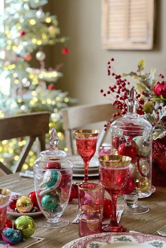 Cranberry glassware adding festive color.