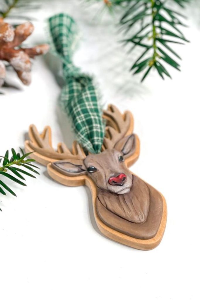 Wooden reindeer crest with rustic charm