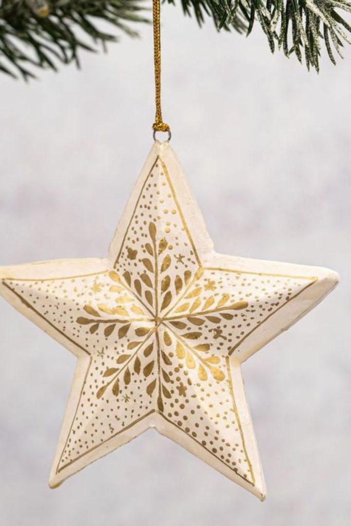 Star crest ornament carved from wood