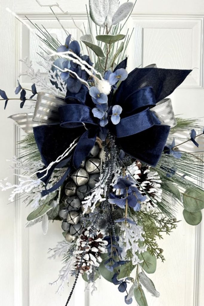 Icy blue ribbon elegant winter wreath
