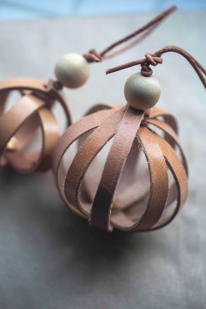 Leather strap ornaments on branches