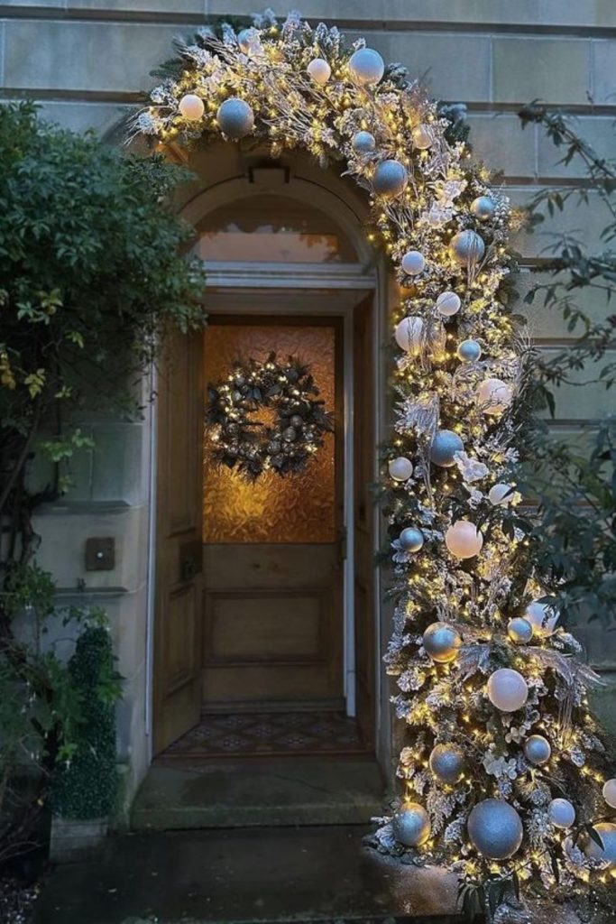 Metallic leaf doorway holiday garland elegance.