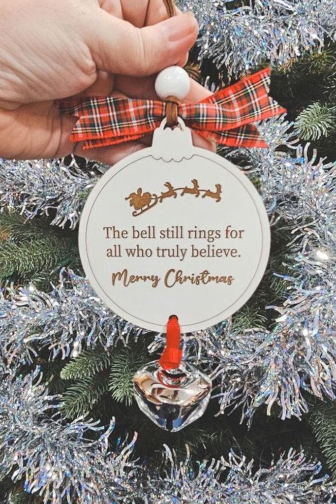 Sleigh bell emblem crafted from wood