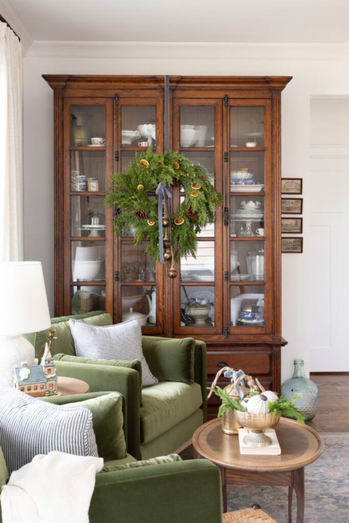 Historic mistletoe hallway with warm candlelight.