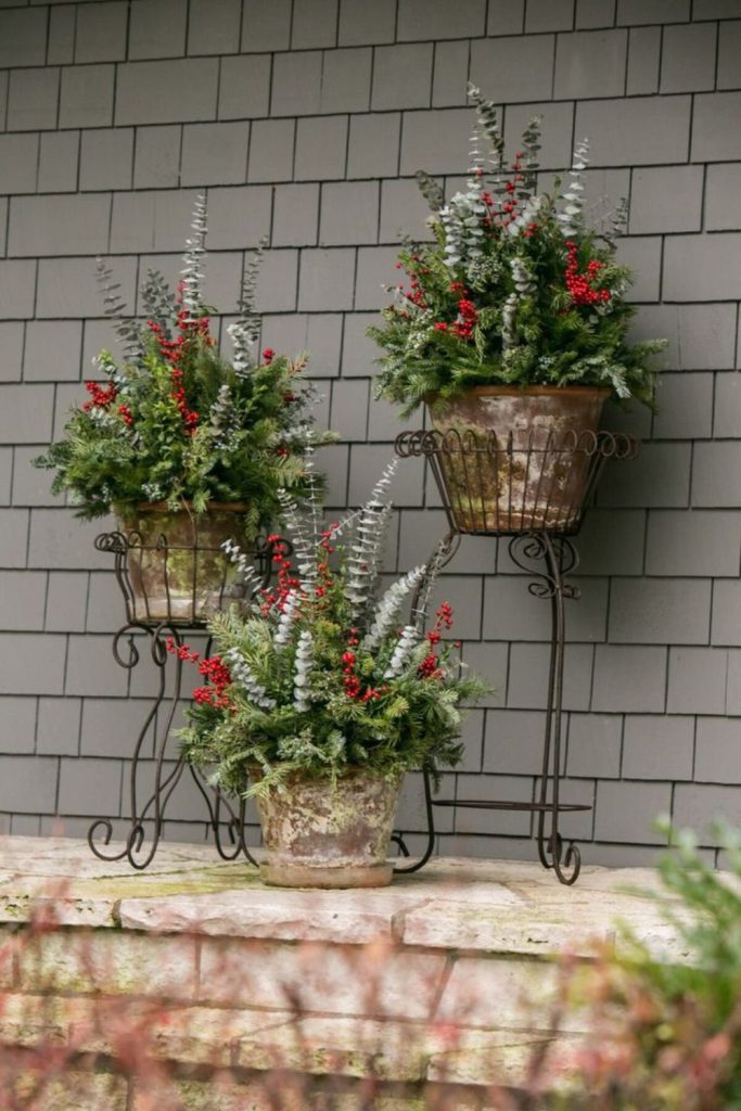Sleigh-style winter greenery porch display