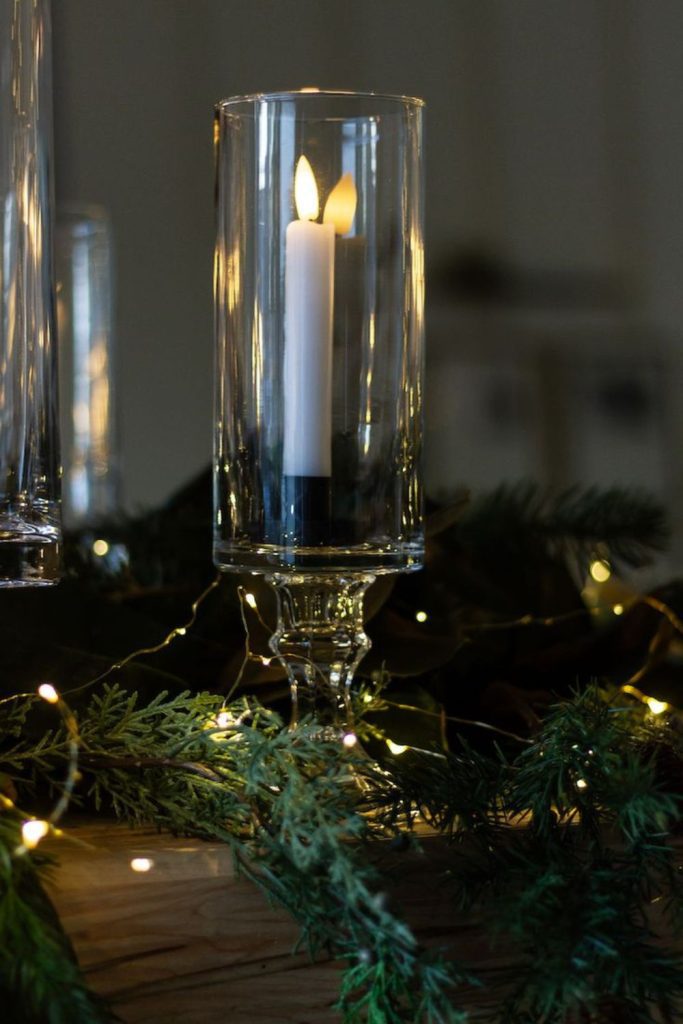 Smoky glass candle holders elegant ambiance.