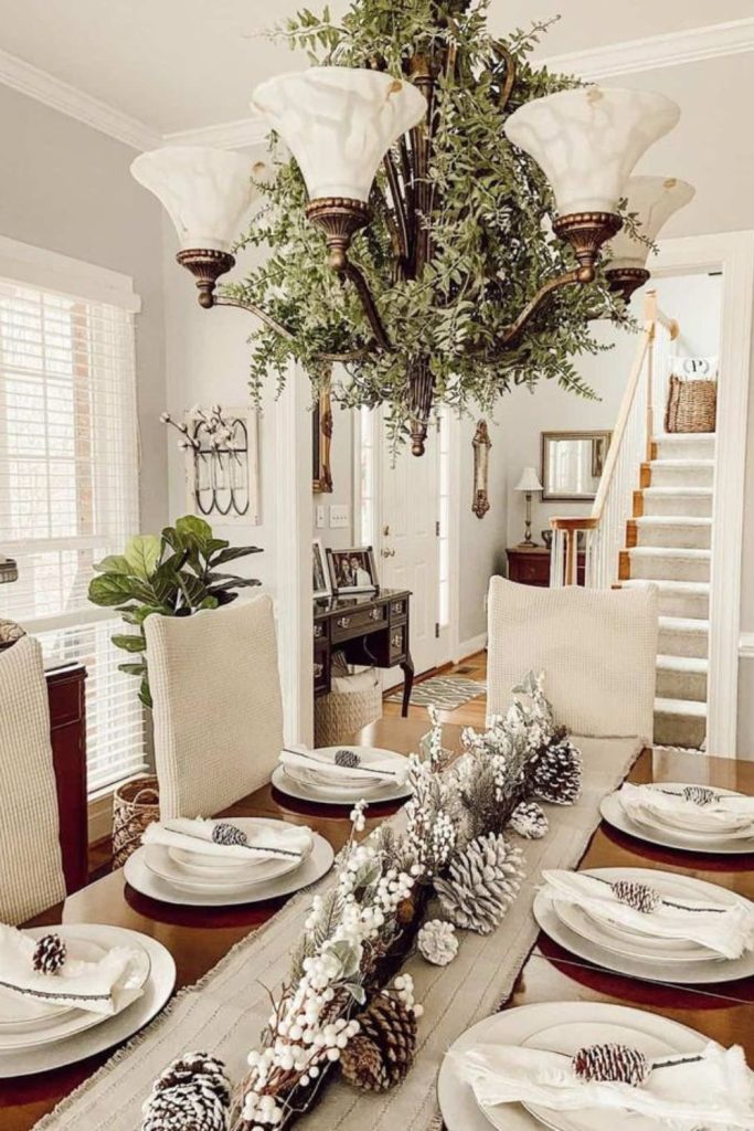 Pinecone chandelier snowy rustic kitchen.