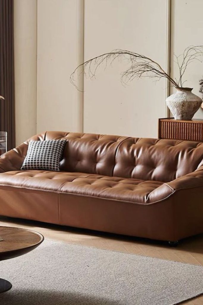 Tufted sofa with cascading plush throws