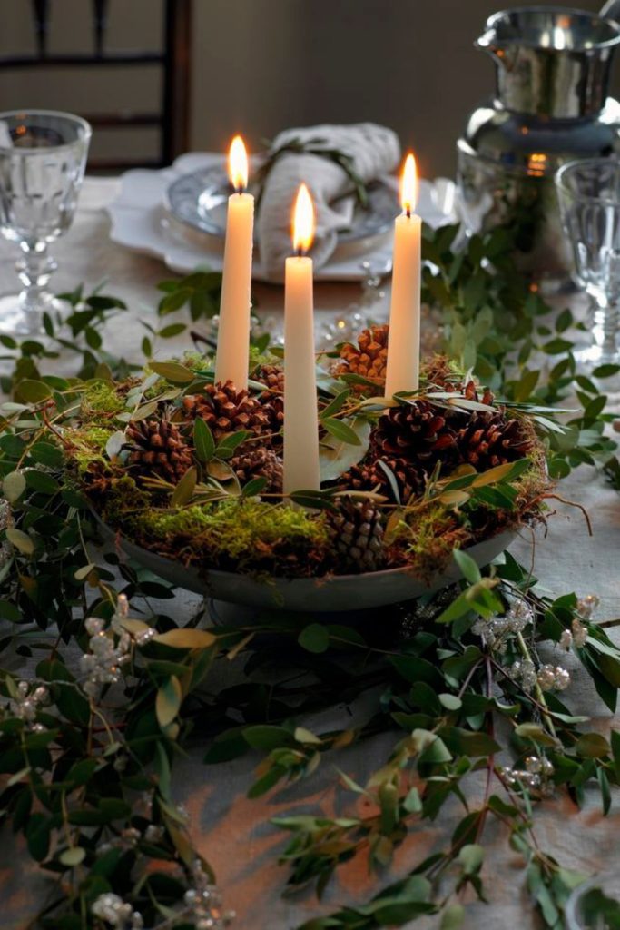 Evergreen spiral with pinecone and candle