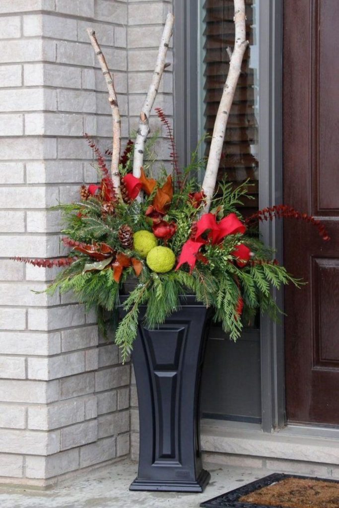 Winterberry twig tower outdoor arrangement