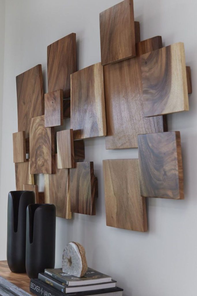 Suspended wooden panels creating abstract wall display