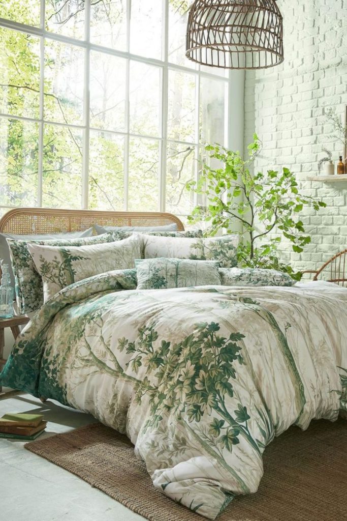 Earthy green bedding with forest theme