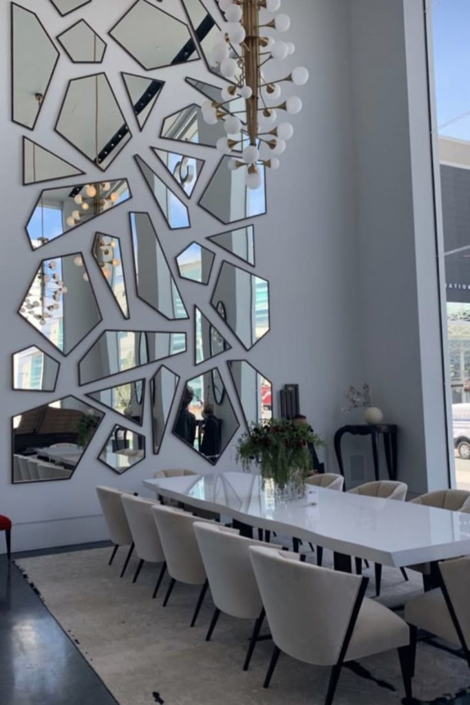 Irregular mirror shards reflecting distorted wall views