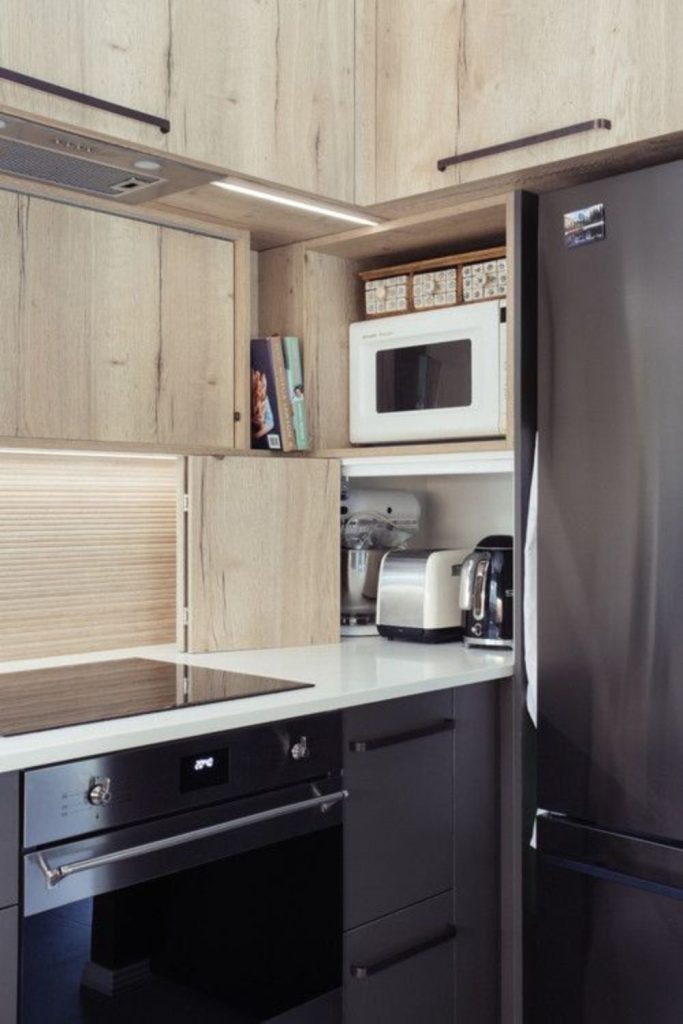 Concealed appliances create seamless kitchen design