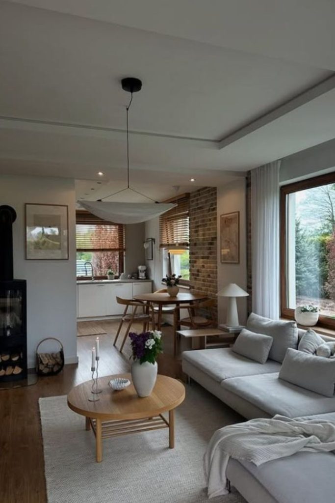 Bright minimalistic living room with open layout.