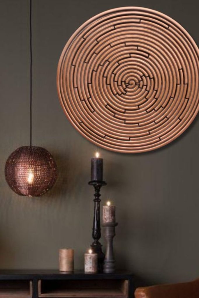 Handcrafted terracotta spirals protruding from walls