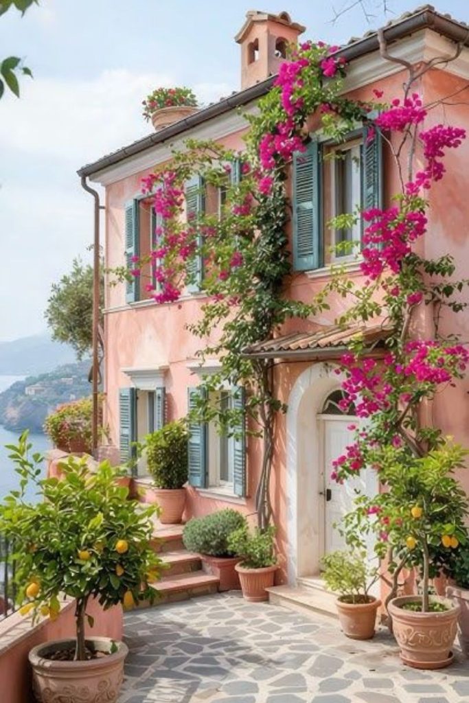 Coral-colored cliffside villa with pergolas