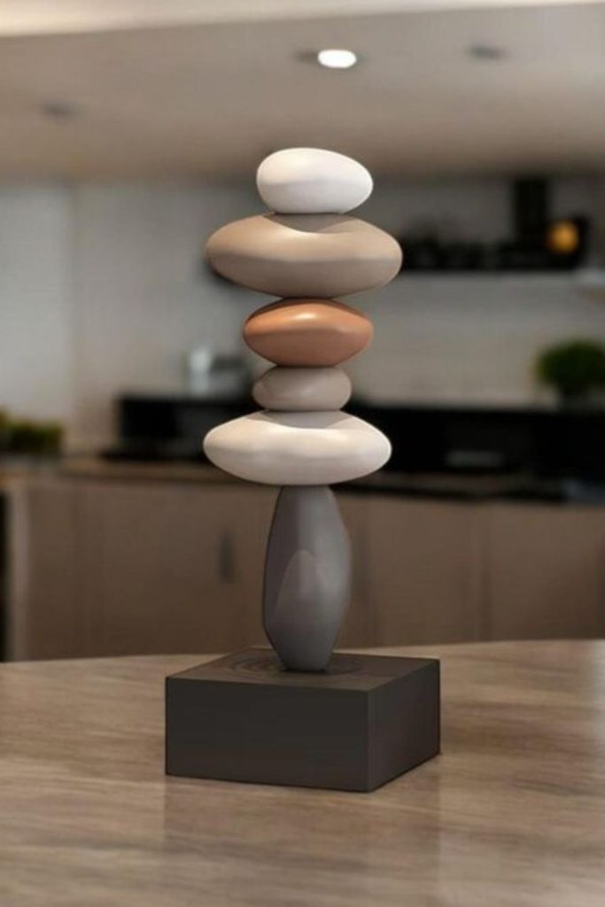 Balanced decorative stone sculptures indoors.