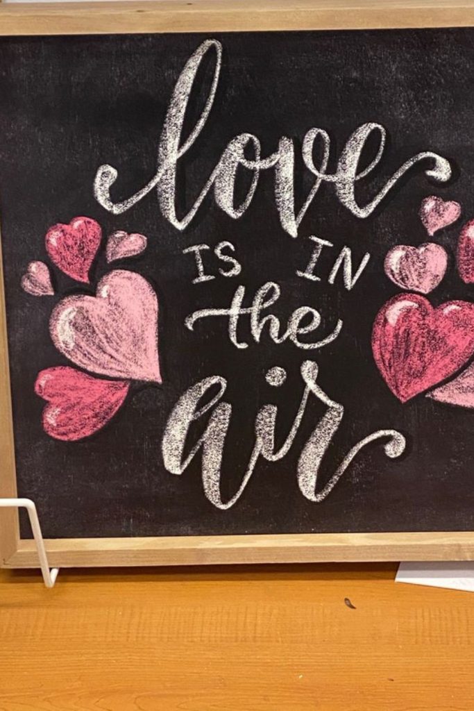 Chalkboard hearts with love notes displayed.