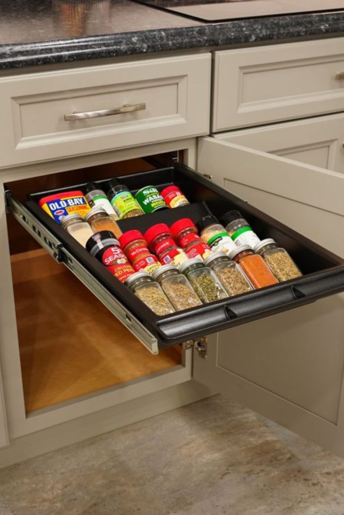 Narrow drawers conceal spice jars neatly.