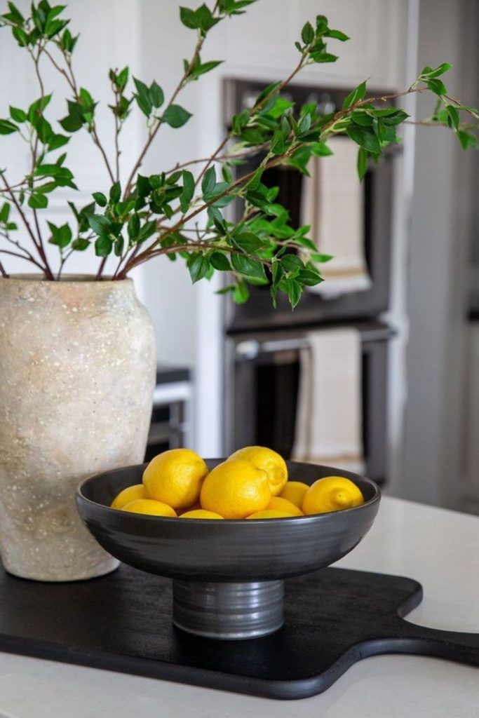 Steel bowls and bonsai create calm.