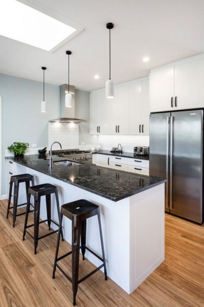 Polar white cabinets and slate counters.
