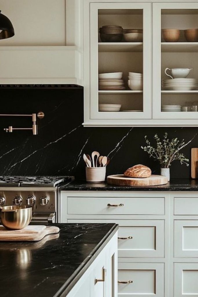 Pure white cabinets against black stone.