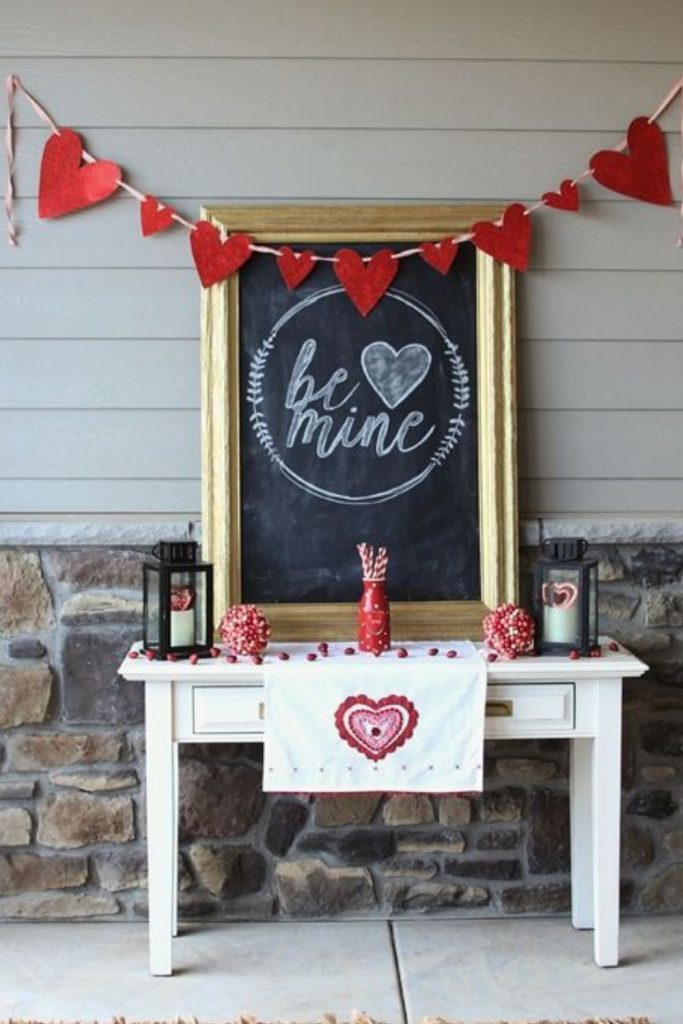 Chalkboard table with love messages and drawings.