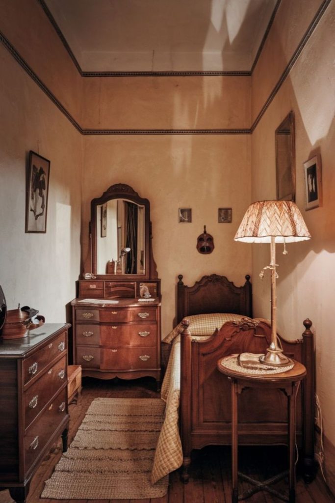 Old trunk, frayed tapestry, warm sunlight