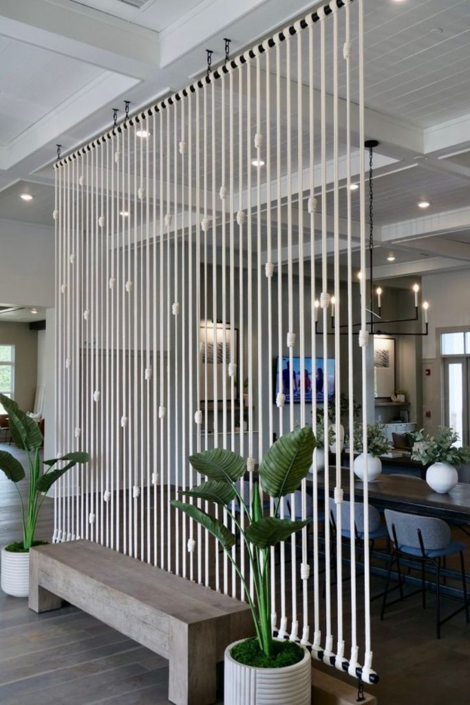 Semi-transparent twisted rope dividers.