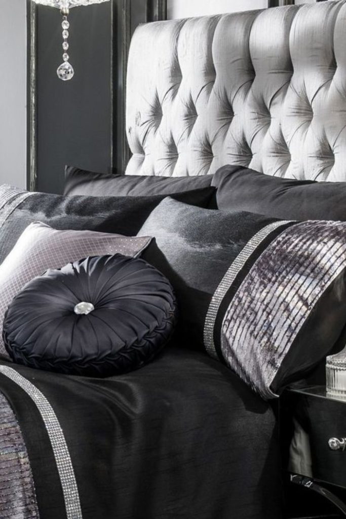 Dark layered luxurious cozy bedroom