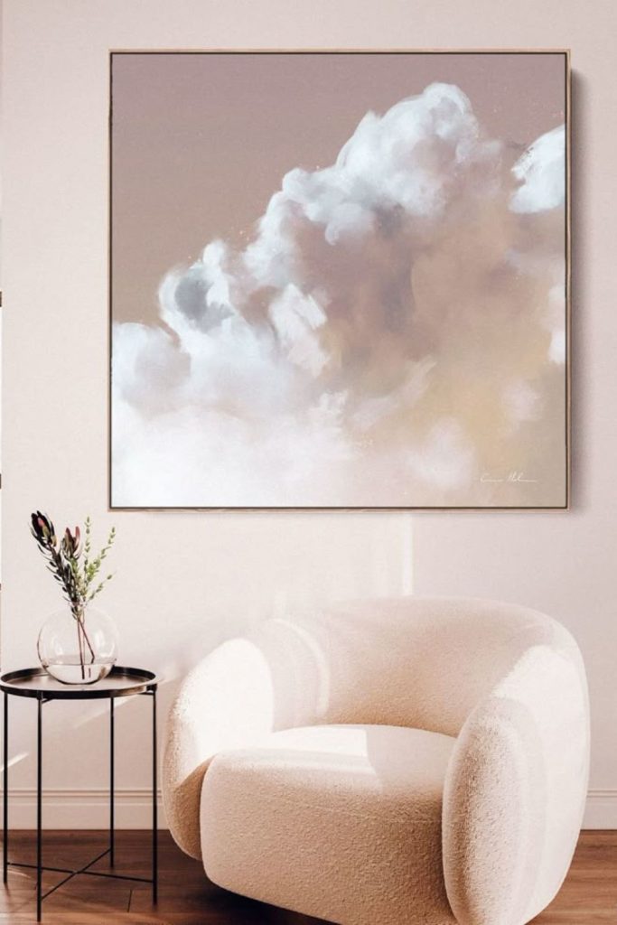 Minimalist white frame cloud on dark wall.