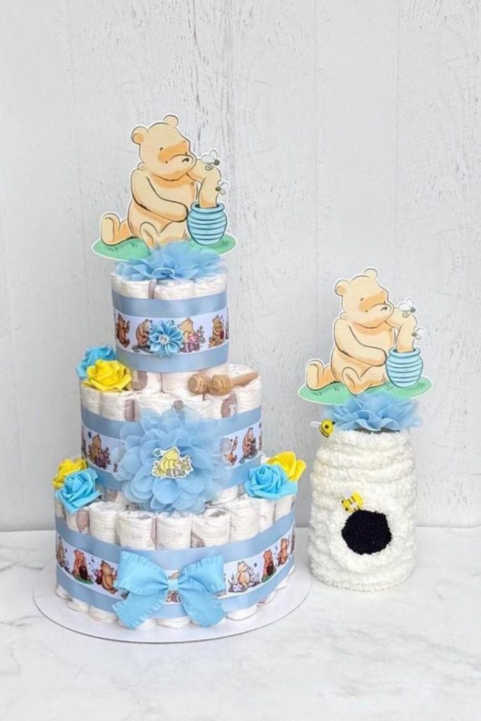 Pooh diaper cake display.