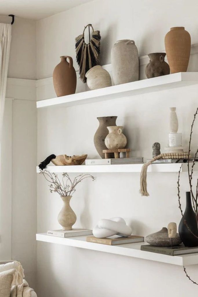 Minimal ceramic vases on shelf.