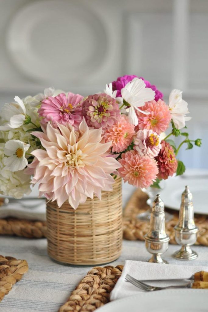 Bold dahlias in haphazard basket arrangement