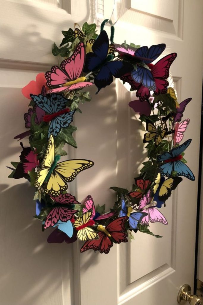 Clustered paper butterflies on circular frame