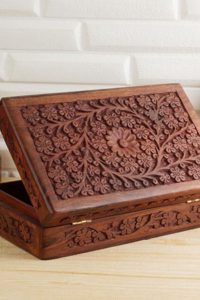 Decorative wooden jewelry box with carvings
